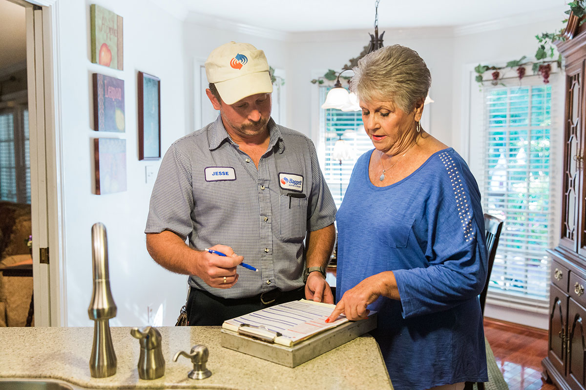 Technician Showing Estimate to Customer
